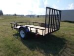 Pillowle 6’4” x 10’ carry-on utility trailer with metal frame and open bed for hauling small loads and equipment.